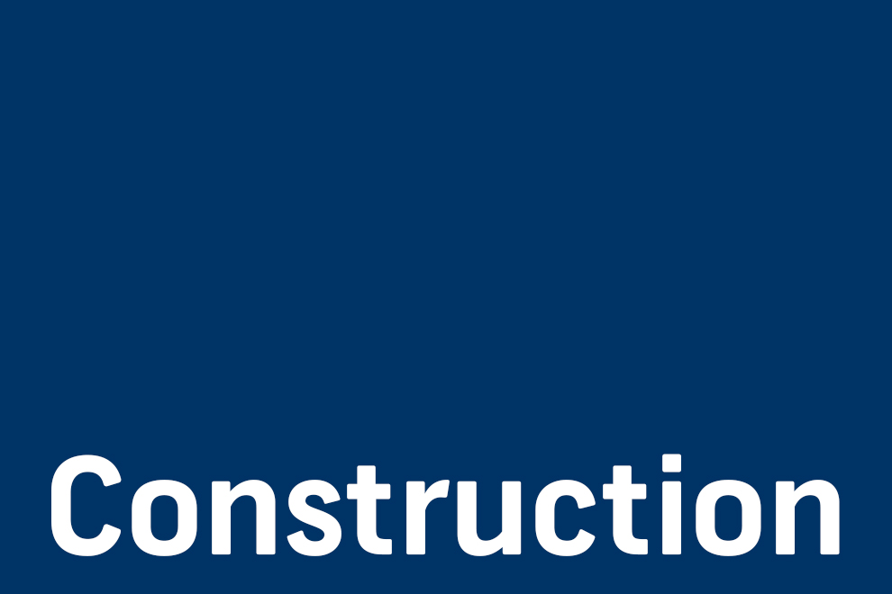 "construction" text on blue rectangle shape