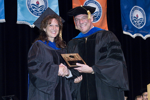 Dr. Serra receiving her award
