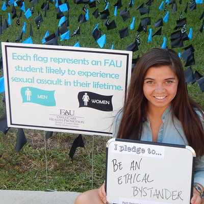 girl in front of sign that states i pledge