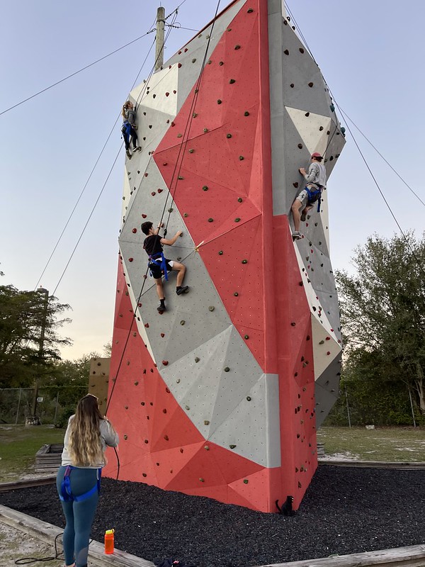 Students climbing the wall