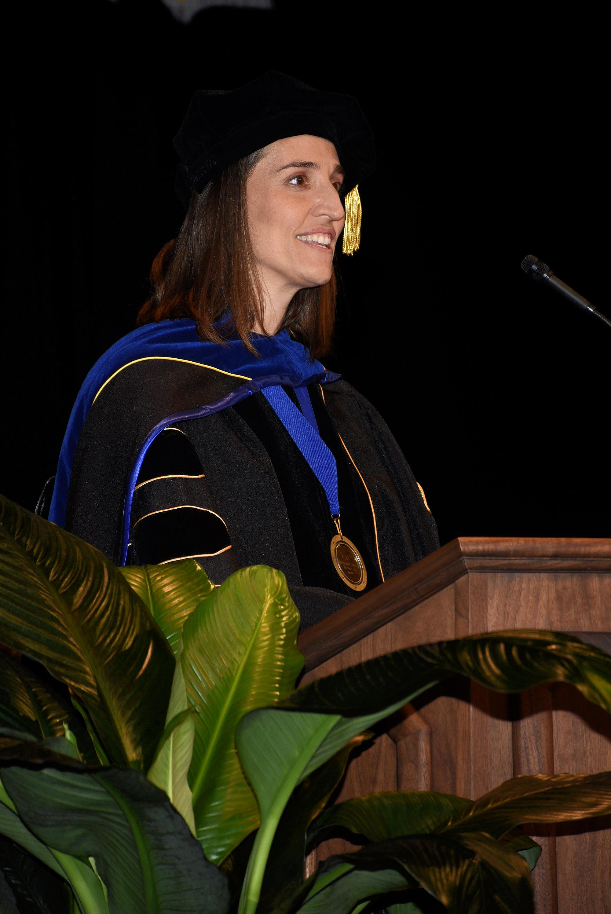 Dr.Laura Vernon speaking at convocation at the podium