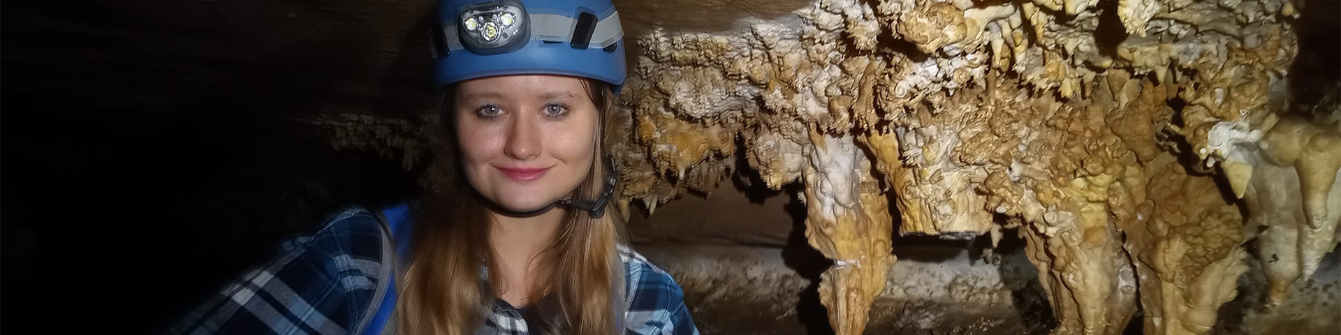Girl in cave smiling