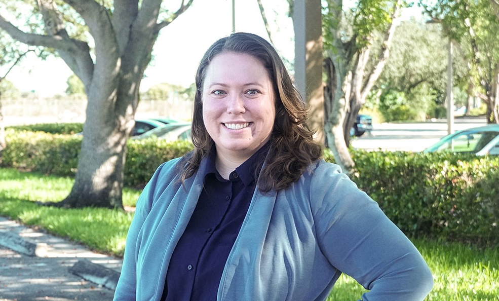 Image of a person standing in front of trees