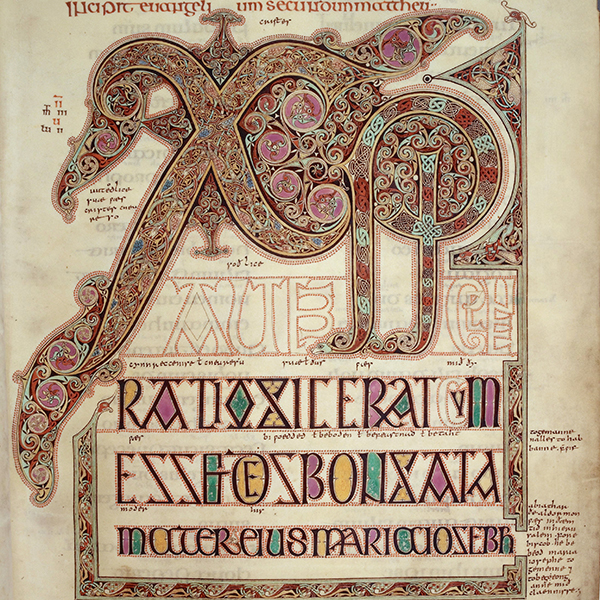 An illuminated manuscript page features elaborate interlaced initials and rows of decorative lettering in red, gold, green, and purple.