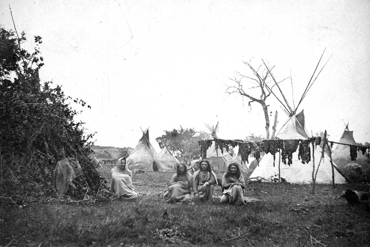 Comanche Buffalo hunters and their tepee lodges. August 1871. Public Domain