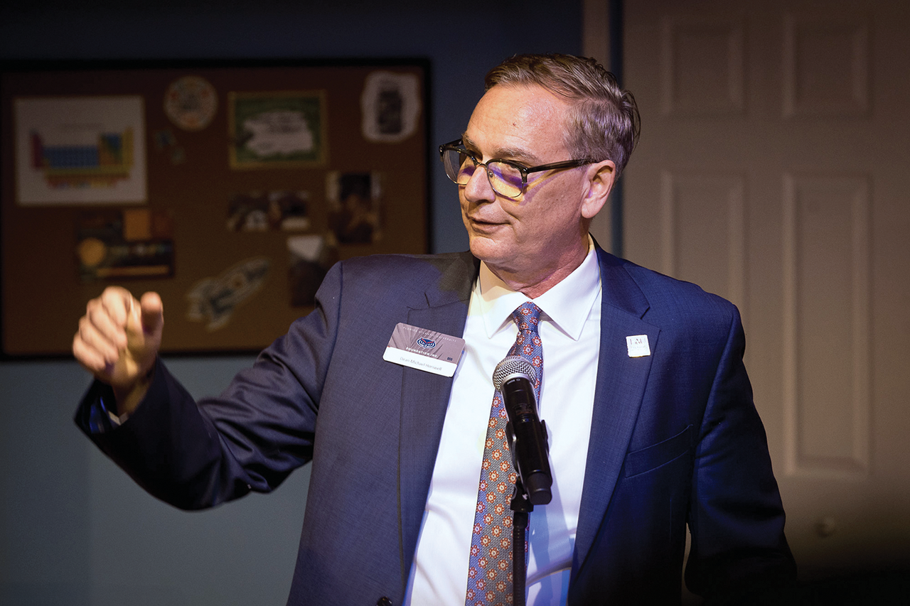 Michael J. Horswell speaking at a podium