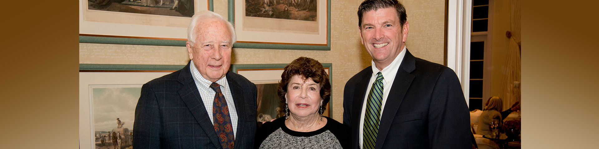 Three people smiling