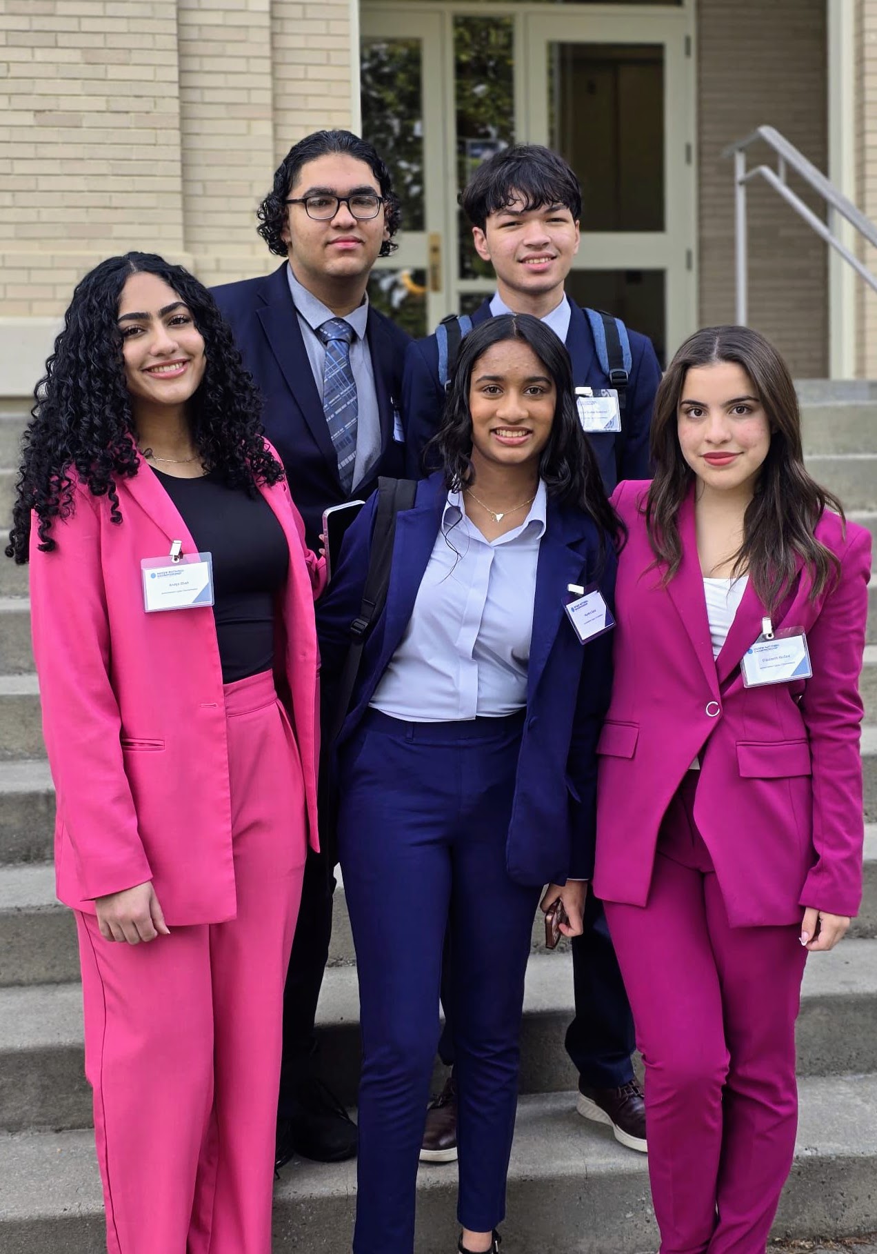 Smiling young people on steps