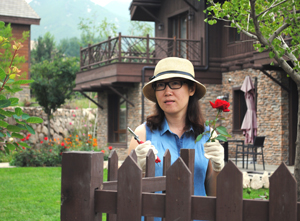 Anne Lui outside her home