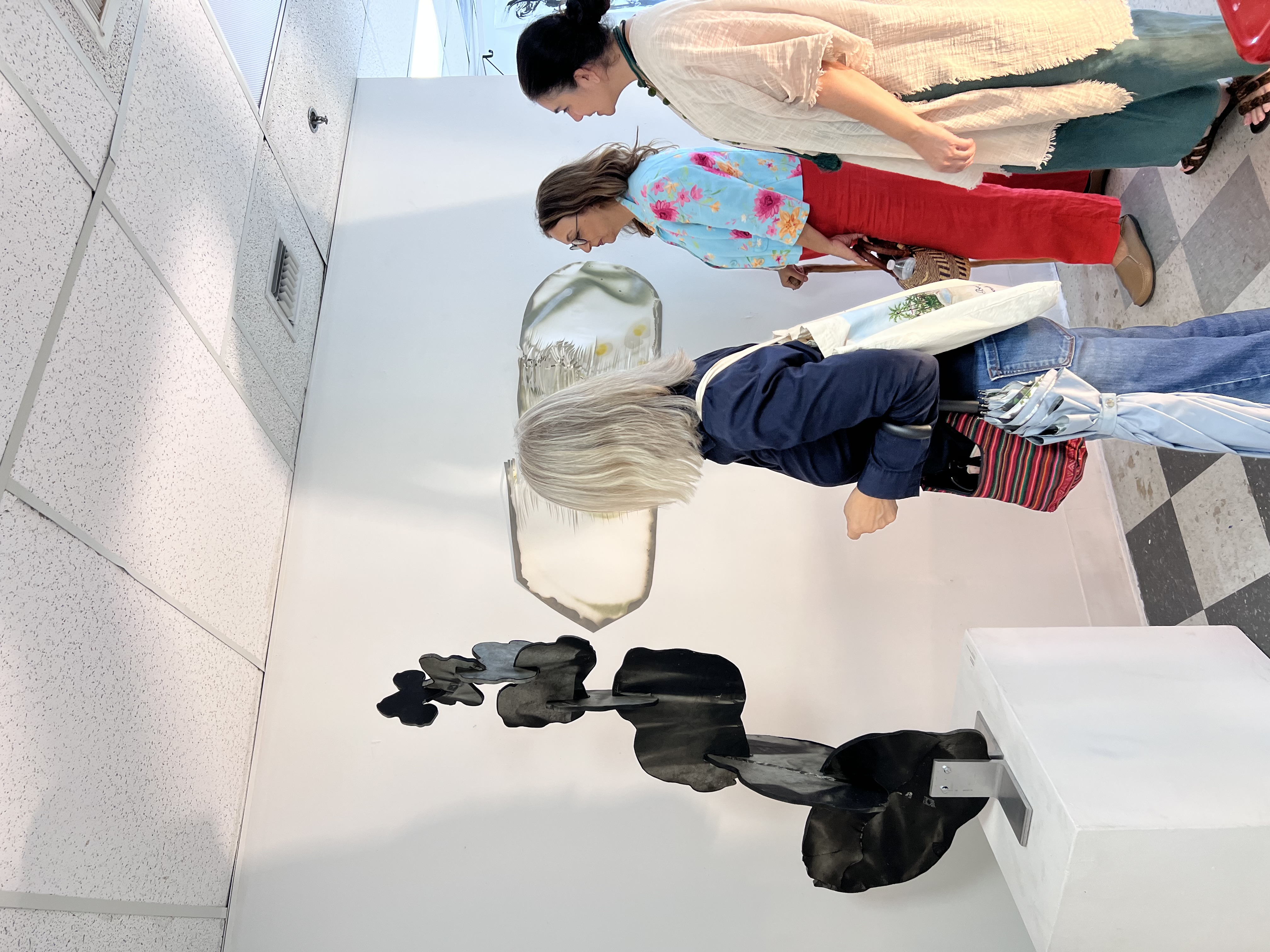 People looking at artwork Spring 2026