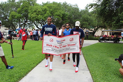 men walking with a sign that states i pledge