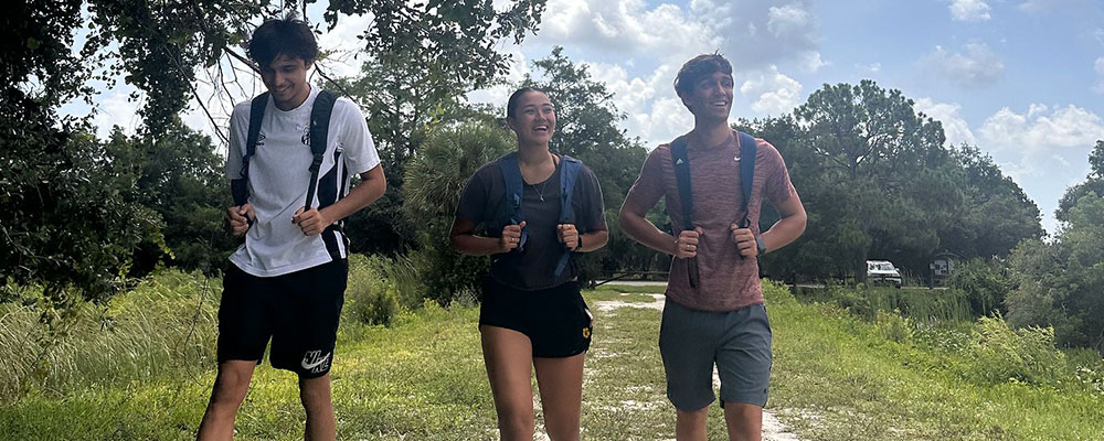 Friends smiling on a nature walk