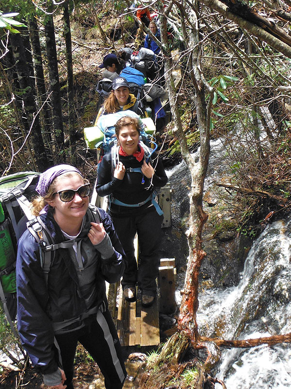 Friends smiling on a nature walk