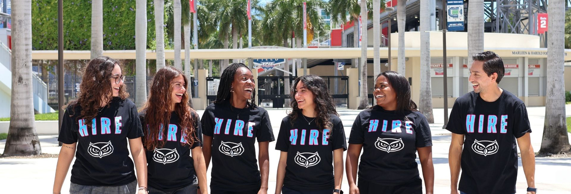 A busy career center with people talking and collaborating.