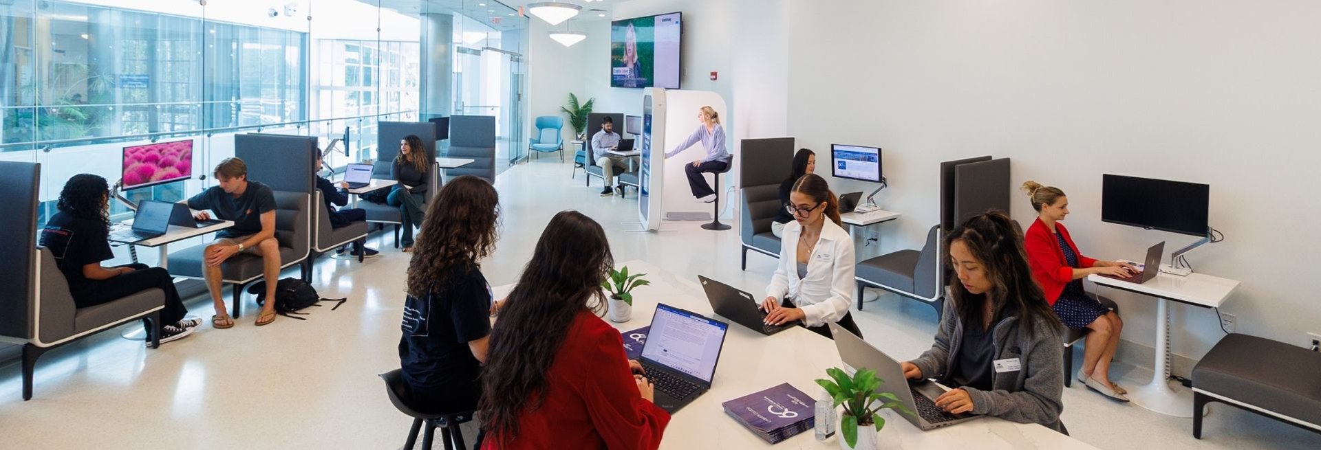 Individuals in the Career Center at table with signs