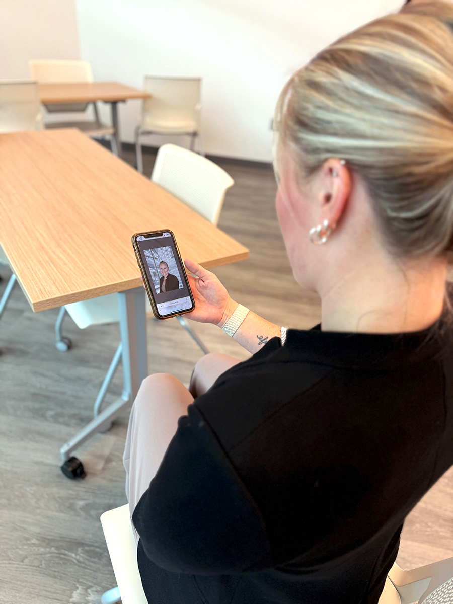 Elise checking her phone with Iris