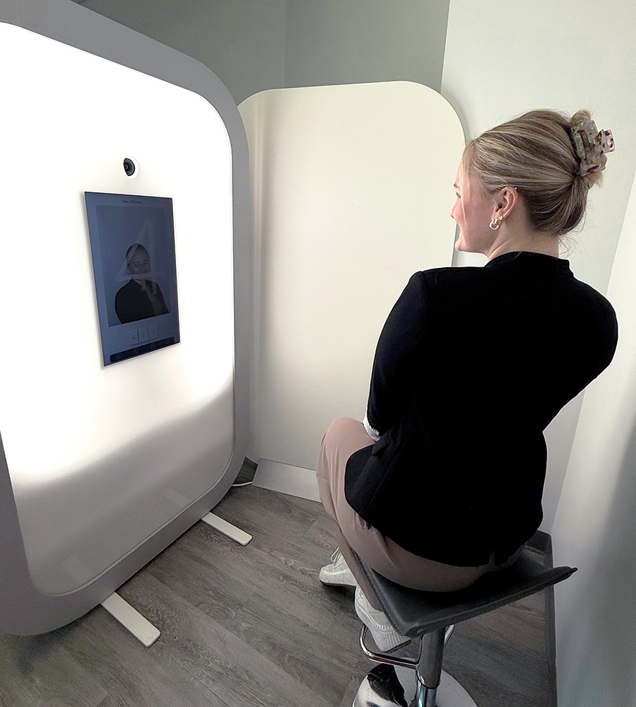 Sitting on a stool looking into the Iris camera