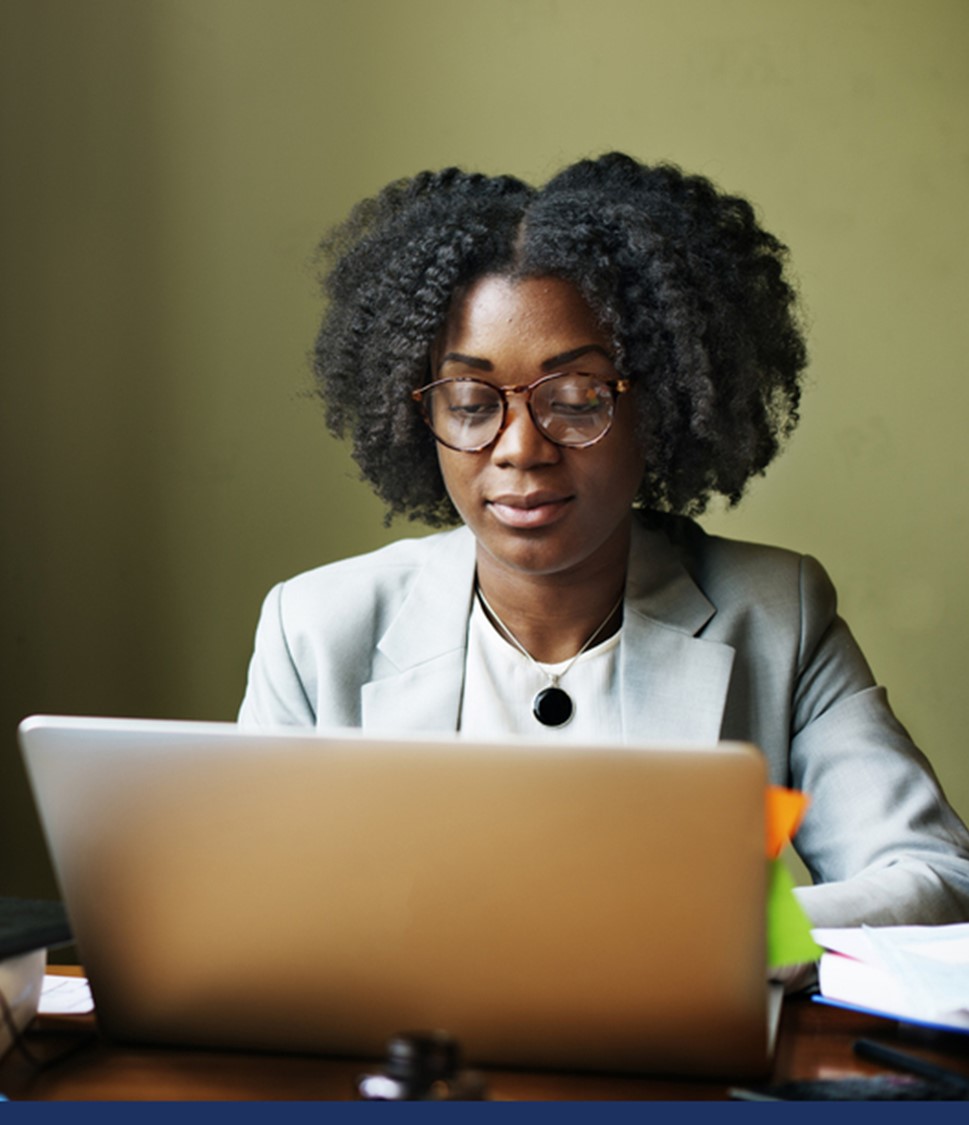 A woman typing on a computer