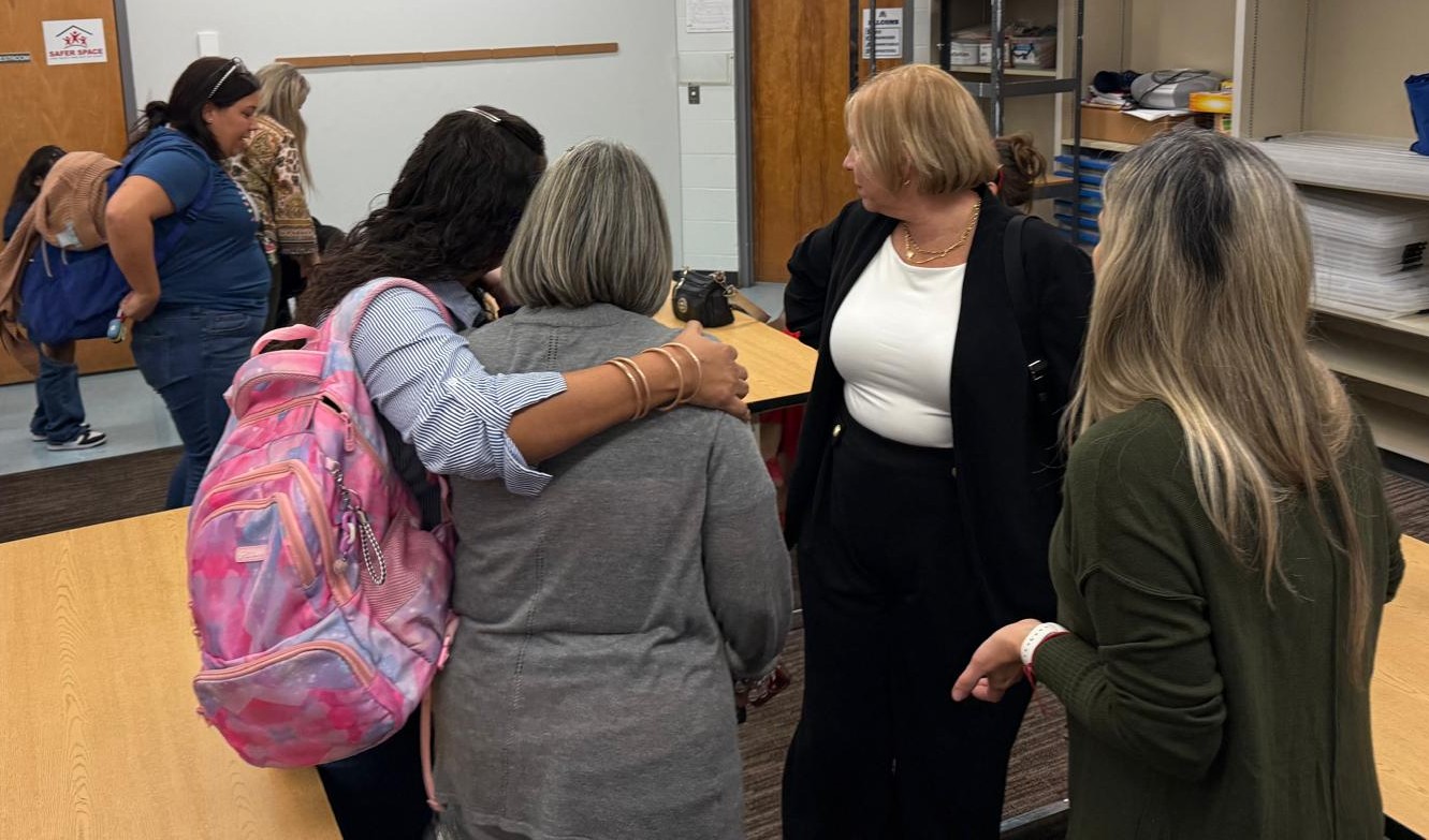 Participants huddling together