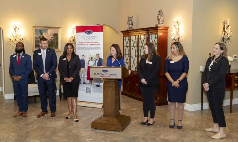Floyd Scholars at a podium.