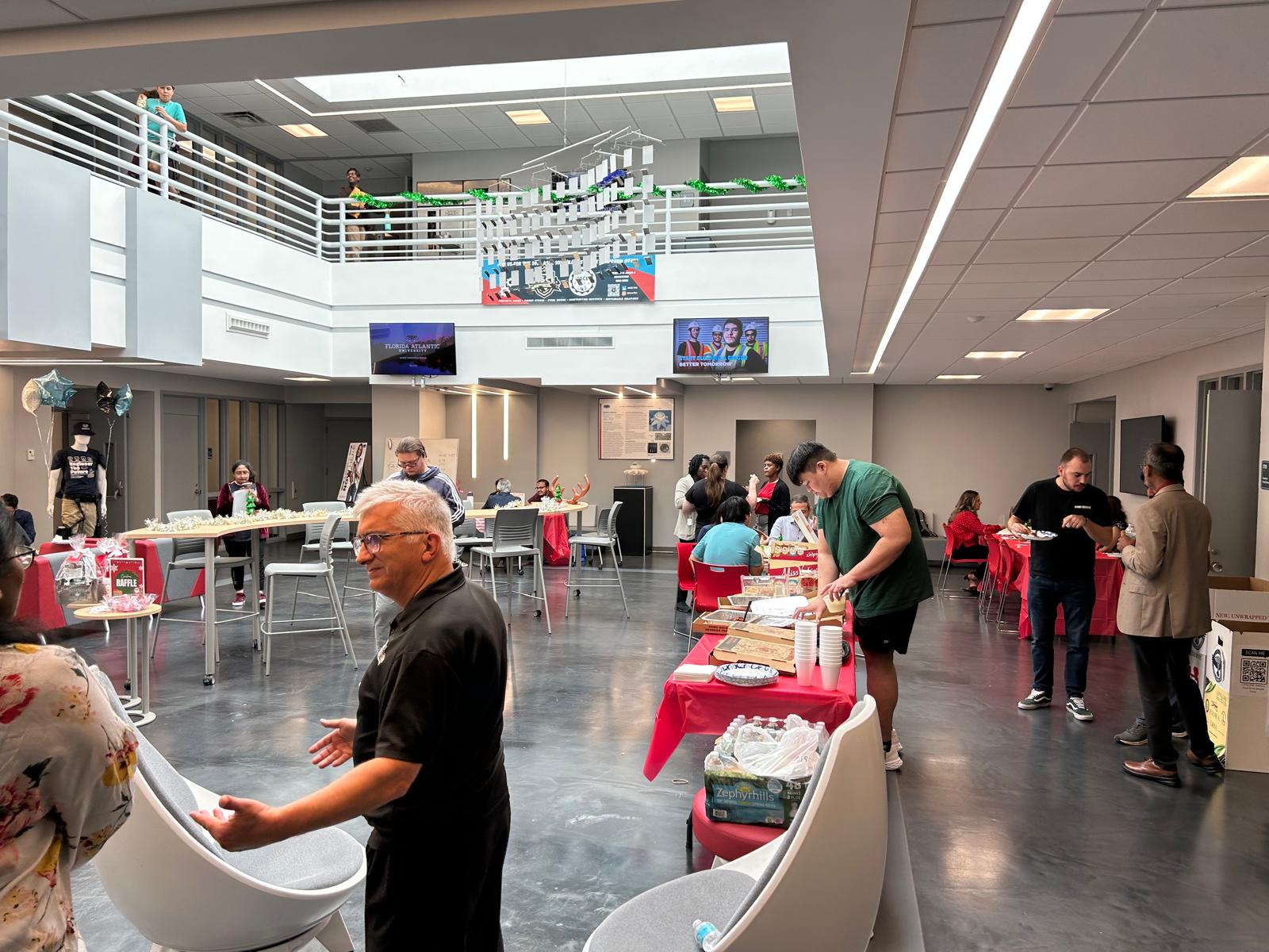 Faculty and students celebrating together at CEGE holiday party.