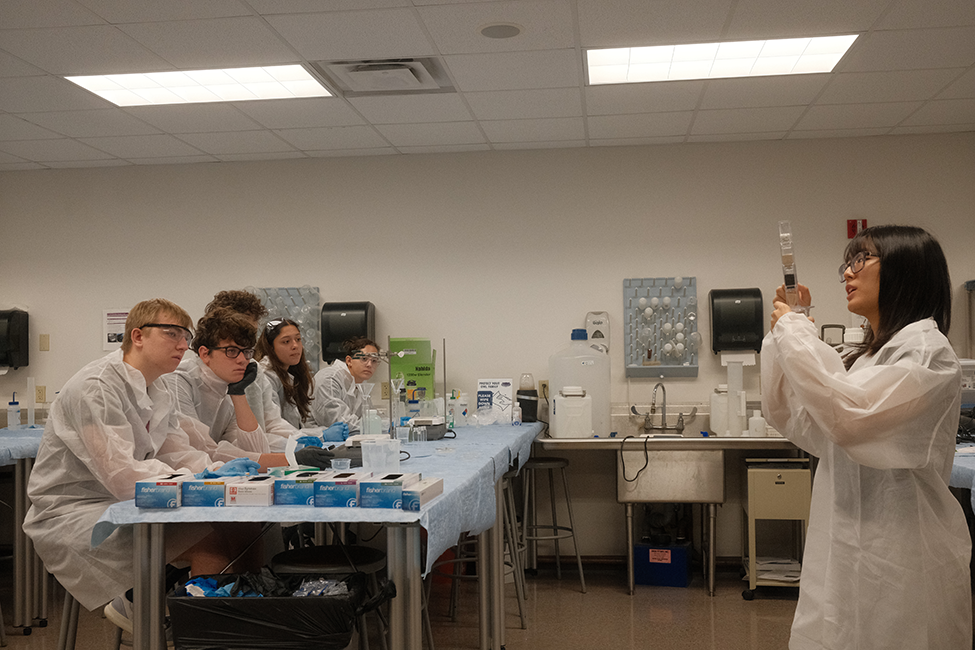 Image of students receiving instruction from Dr. Liu.