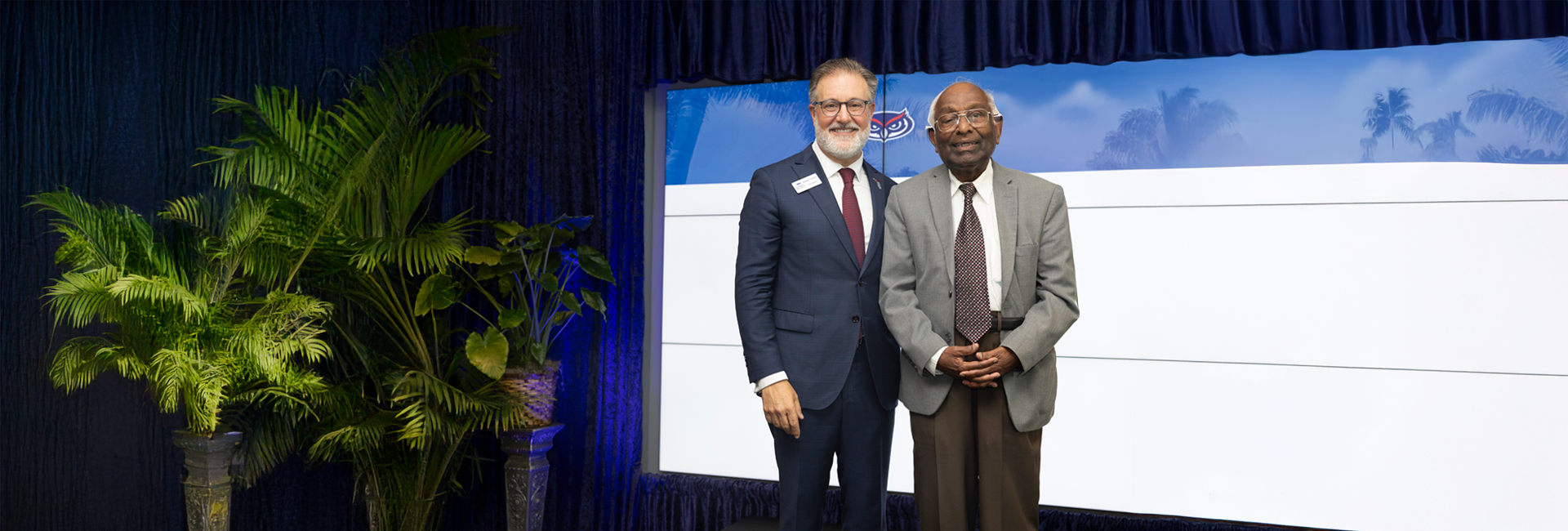 Dr. Arockiasamy standing beside FAU President Adam Hasner.