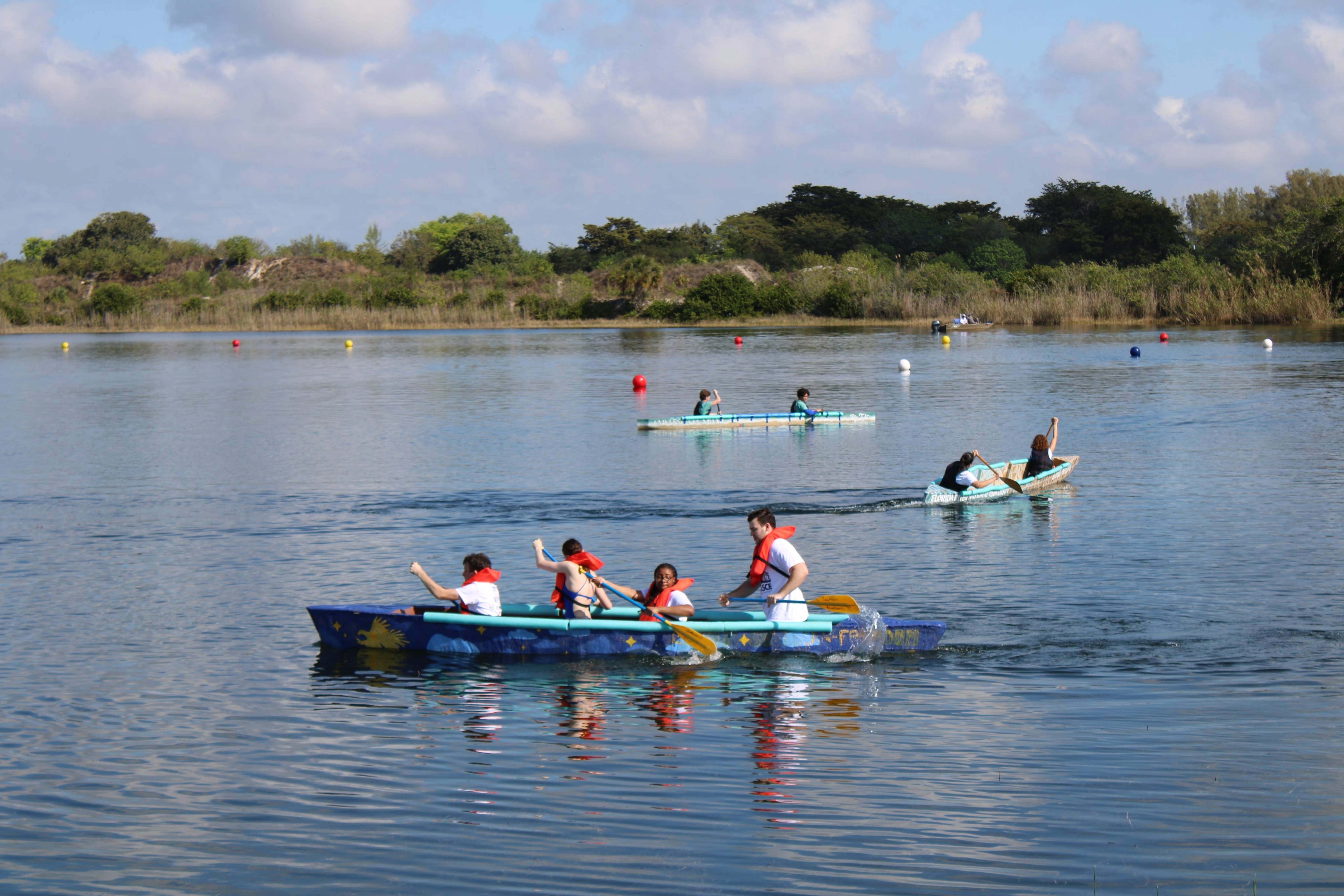 Students race canoes at South County Park.