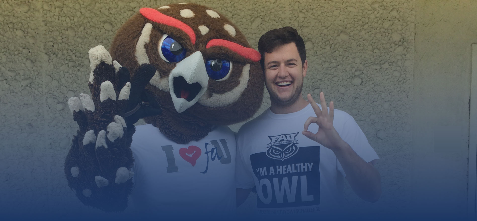 Owlsley and student in a healthy owls shirt