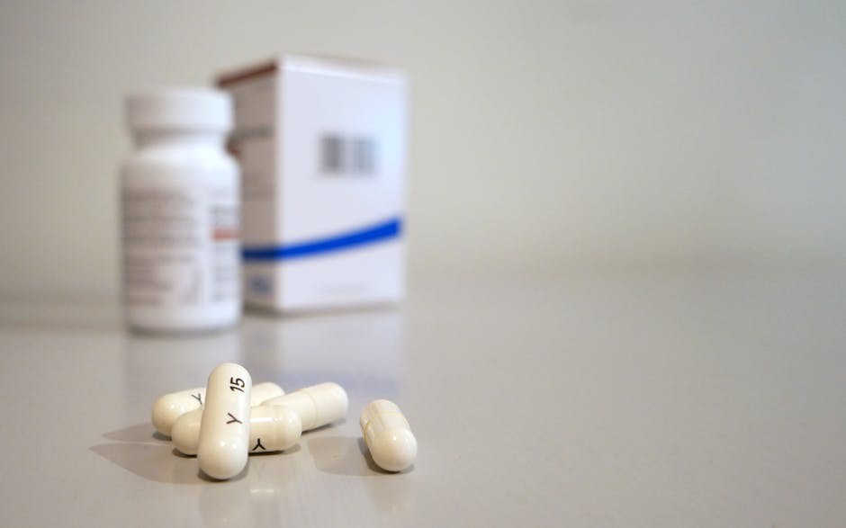 a close-up of white pills on a table