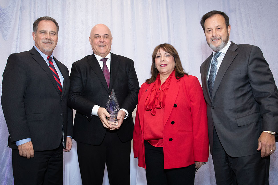 From left, Daniel Gropper, Ph.D., dean of FAU’s College of Business; Patrick Geraghty, Business Leader of the Year honoree; FAU President Stacy Volnick; and John B. Ramil, chair of Florida Blue.