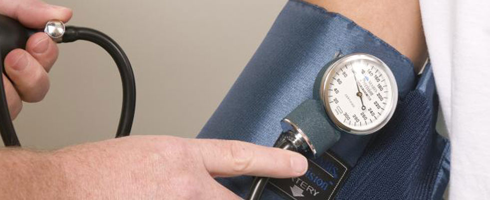 image of hand and blood pressure cuff