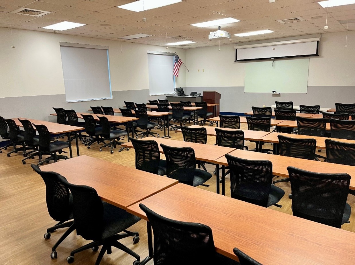 back view of classroom with tables and 48 chairs