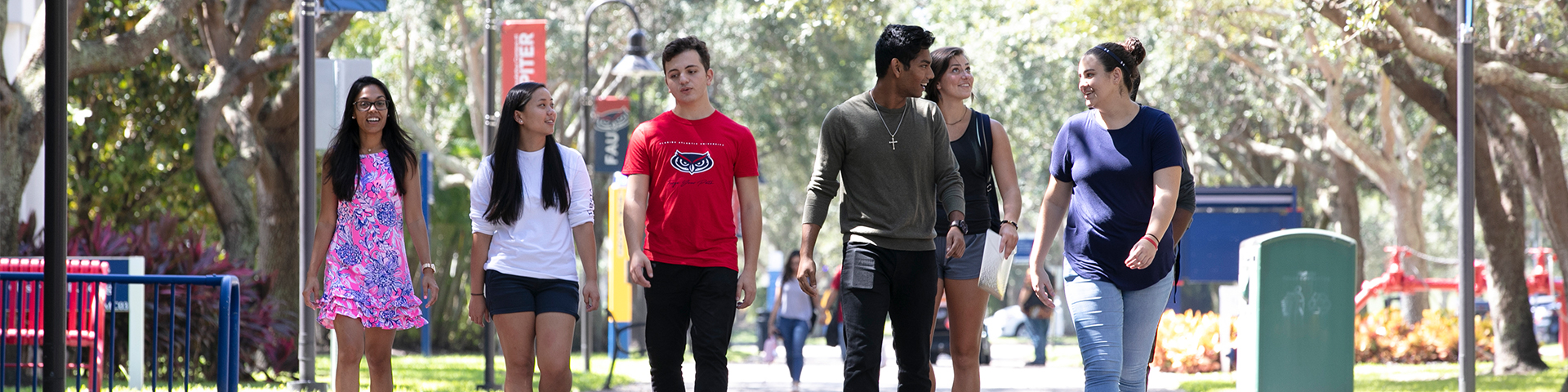 Students walking down campus sidewalk