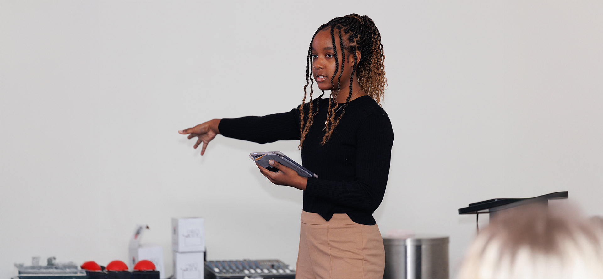 Student leader giving directions in the middle of a room