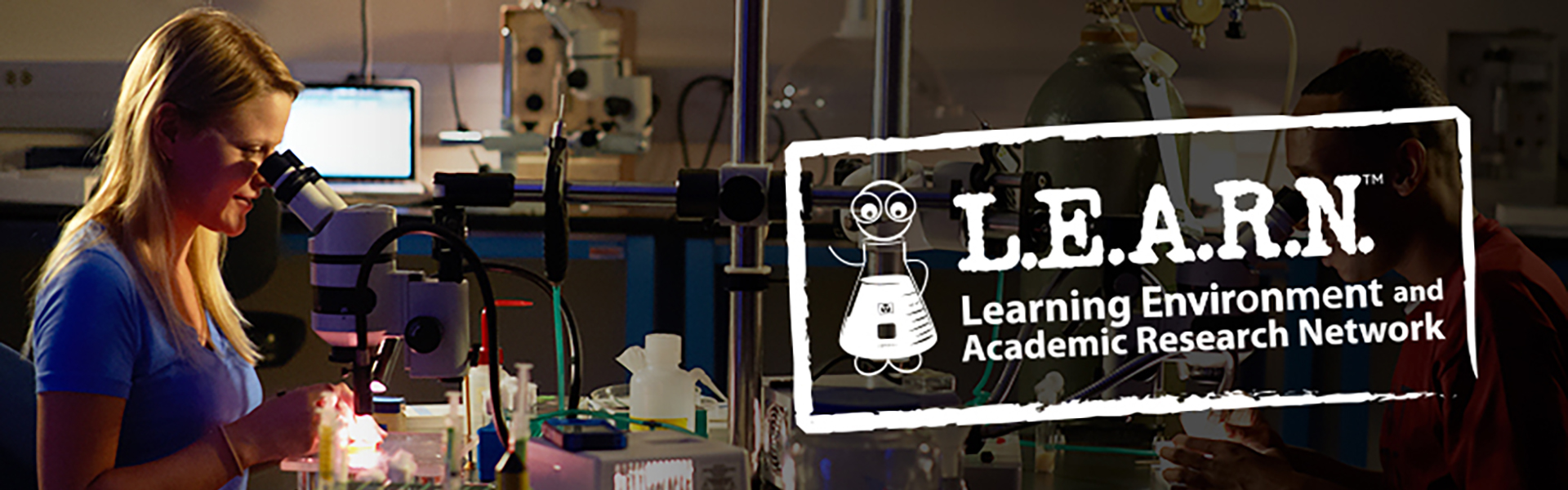 L.E.A.R.N. banner - students in a lab