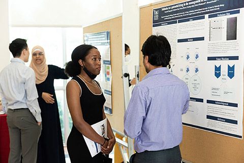 Graduate students at annual graduate research day presenting work