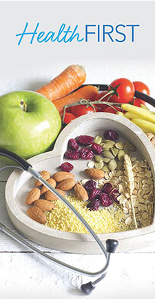 Fruits, vegetables, and nuts in a heart shaped bowl with stethoscope