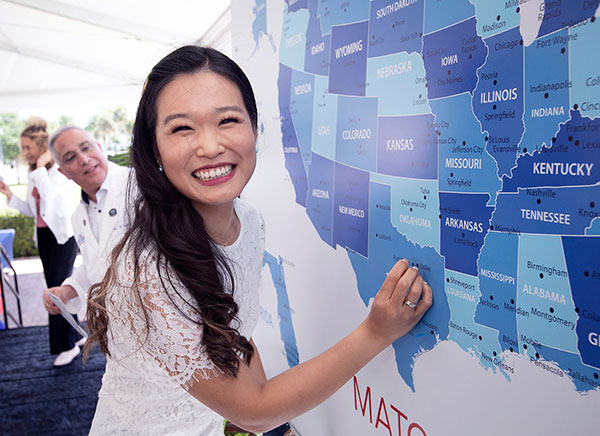 FAU Schmidt College of Medicine student placing pin on Match Day Map