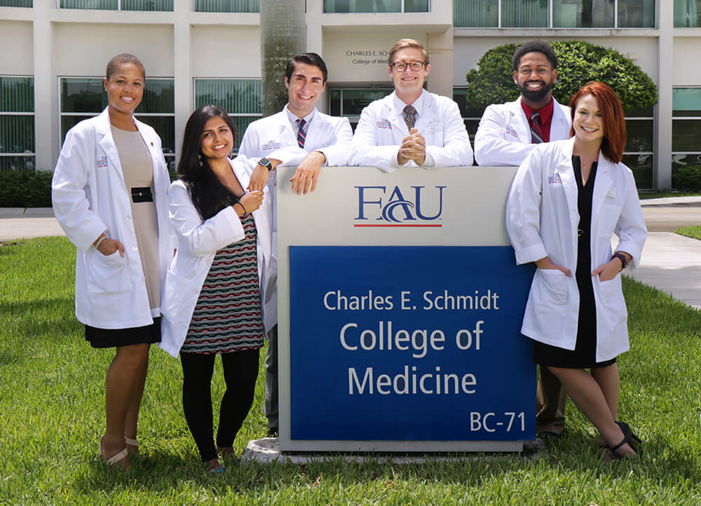 Medical students outside the Schmidt College of Medicine building on FAU Boca Raton campus