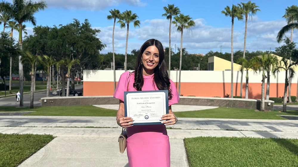Dr. Lea Sacca with award outside ceremony