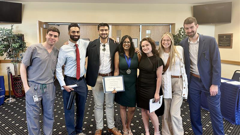 Dr. Perumareddi with students at ceremony