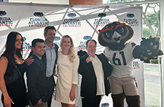 Jaclyn Klimczak with family and friends, along with Owlsley, at the FAU Hall of Fame and Distinguished Alumni Award Ceremony