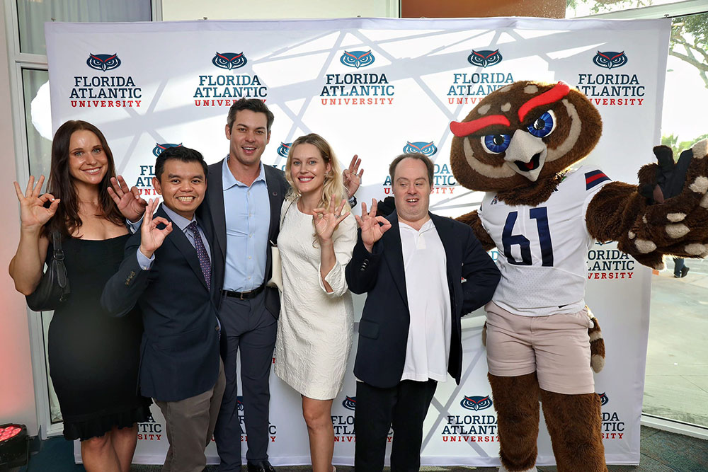Jaclyn Klimczak with family and friends, along with Owlsley, at the FAU Hall of Fame and Distinguished Alumni Award Ceremony