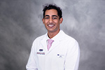 Portrait of Nikhil Prabhakar in white coat