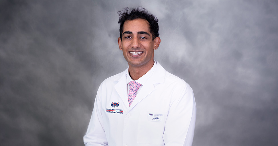 Portrait of Nikhil Prabhakar in white coat