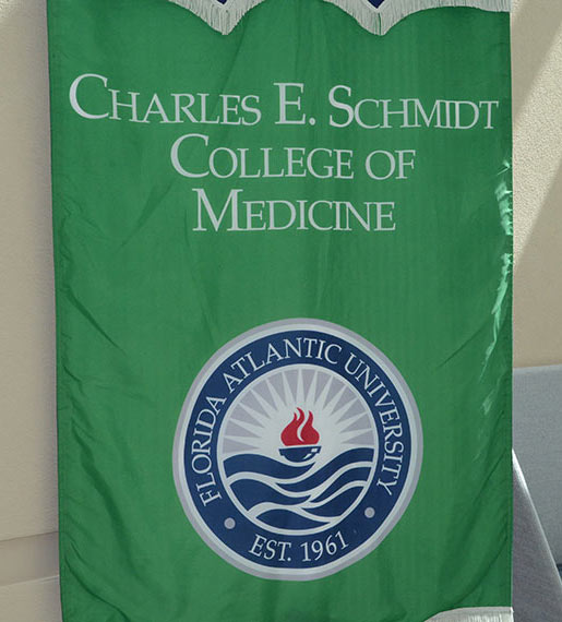 FAU Schmidt College of Medicine banner hanging inside of atrium entrance