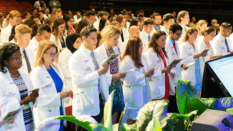 Students taking the oath at the annual White Coat Ceremony