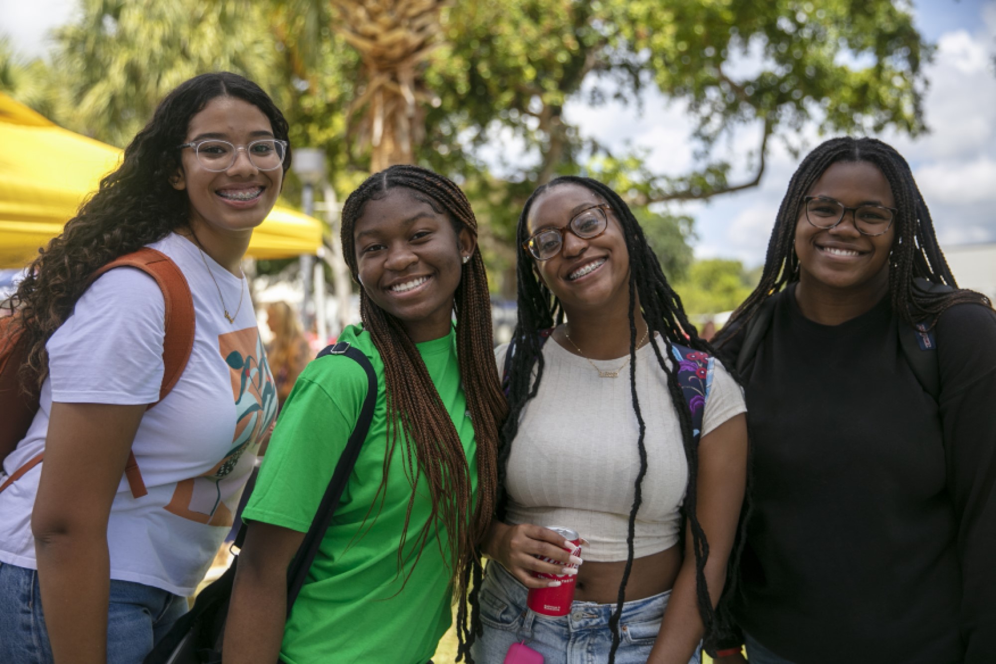 Four students smiling