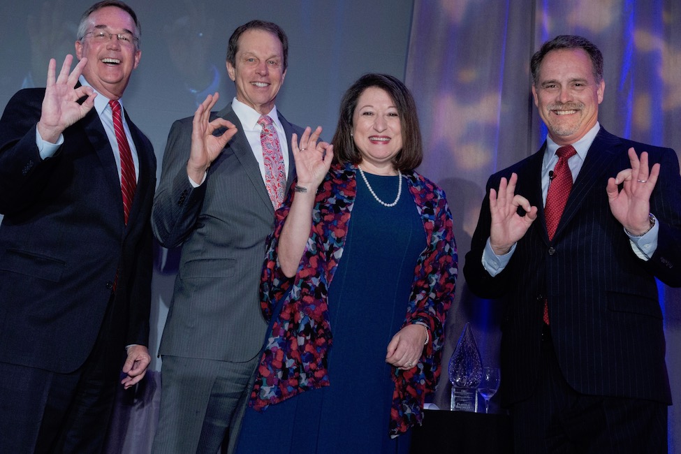 Pictured from left are FAU Chief Financial Officer Jeff Atwater, FAU President John Kelly, 2018 Business Leader of the Year Fabiola Brumley, and FAU College of Business Dean Daniel Gropper. 